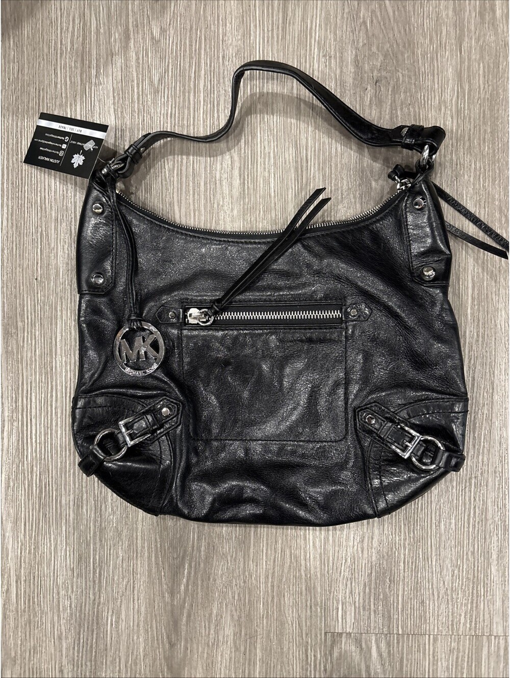 Woman’s Michael Kors Leather Zip Handbag With Big Metal Logo Pendant